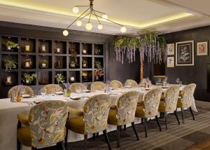 a dining room with a long table and chairs at Hyatt Regency Birmingham in Birmingham