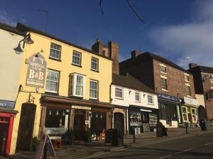 a row of buildings on a city street at Bridge View Guest House in Ironbridge