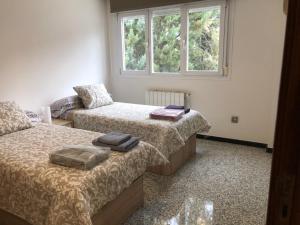 A bed or beds in a room at Luxury Apartment in Moncloa-Aravaca