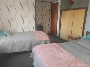 Ένα ή περισσότερα κρεβάτια σε δωμάτιο στο Hostal Klein