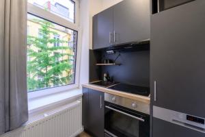 Η κουζίνα ή μικρή κουζίνα στο Royale Apartaments Central City Cologne