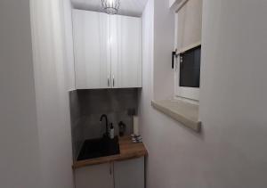 Kuchyňa alebo kuchynka v ubytovaní Zakopartment Zamoyskiego