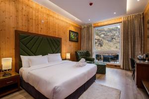 Rúm í herbergi á Palchan Hotel & Spa - A member of Radisson Individuals Retreats