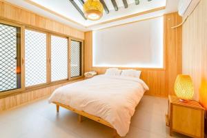 Postel nebo postele na pokoji v ubytování Ellon Hanok Pension