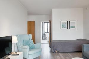 Et opholdsområde på Comodo Apartments - One bedroom apartment - Munkkisaari, Helsinki