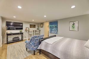 a bedroom with a bed and a flat screen tv at Northern Kentucky Studio Near Cincinnati! in Southgate