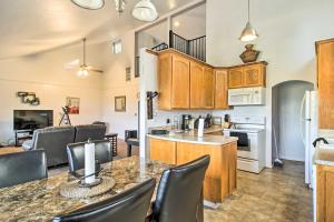 a kitchen and living room with a table and chairs at Lake View Home with Grill Hike, Boat, Relax! in Kelseyville