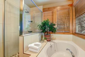 a bathroom with a tub and a potted plant at 4 Bed 4 Bath Vacation home in Oaks at Wasatch in Cottonwood Heights +34 photos