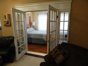 a room with a door open to a bedroom at 2 bed, 1 bath riverfront loft in Salisbury