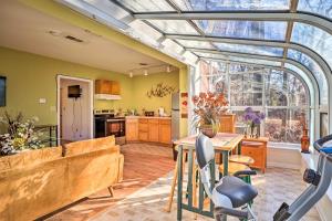 a kitchen with a glass ceiling and a table with chairs at Wilmington Apartment - Close to Hiking and Dtwn in Wilmington
