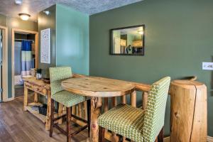 a dining room with a wooden table and chairs at Cozy Eden Condo with Mtn Views in Wolf Creek Resort! in Eden