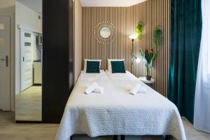 מיטה או מיטות בחדר ב-Modern apartment in best location
