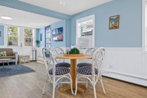 a dining room with a table and chairs at Gammys Beach Getaway Sleeps 20 2 blocks to Beach in Ventnor City