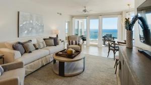 a living room with a couch and a table at Tranquillity 340 in Panama City Beach