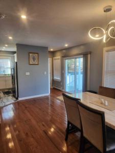 a kitchen and dining room with a table and chairs at Newly updated 3 bedrooms luxury house in Worcester