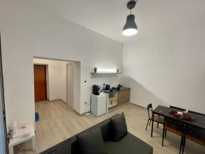 a living room with a couch and a table at House Toledo in Naples