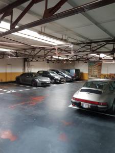 a group of cars parked in a parking lot at Hotel Carlton in Ghent