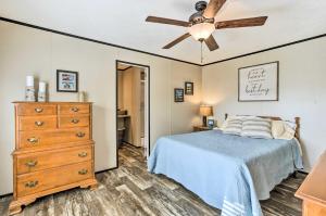 a bedroom with a bed and a ceiling fan at Lakefront Wetumpka Escape with Furnished Deck! in Wetumpka