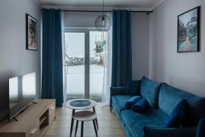 Posedenie v ubytovaní Apartament Słoneczny z tarasem i ogrodem