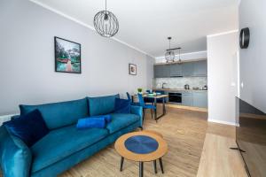 Posedenie v ubytovaní Apartament Słoneczny z tarasem i ogrodem