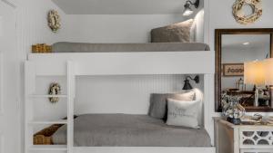 two bunk beds in a room with a mirror at Beachwood Villas 1D in Santa Rosa Beach +39 photos