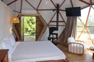 a bedroom with a bed in a tent at Mandalin Glamping in Selçuk