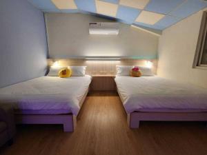 Voodi või voodid majutusasutuse BeiHe Village BnB toas
