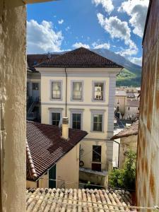 a large white house with a roof at Casa di montagna nel borgo di Rocca di Mezzo in Rocca di Mezzo