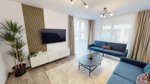 Μια τηλεόραση ή/και κέντρο ψυχαγωγίας στο Apartment by the Lake Nr 4 VRT
