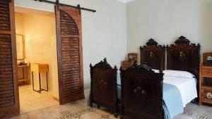 A bed or beds in a room at Baglio Sant’Angelo