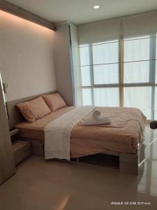 Postel nebo postele na pokoji v ubytování Apple Beach ChaAum
