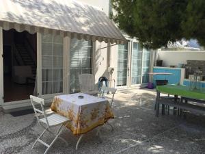a table and chairs sitting on a patio at Aphrodite Suites in Kini