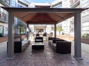 a gazebo with couches and tables in a building at Luxury Apartment WiFi, Gym, Pool, Shops & Food! Unit 329 in Charlotte