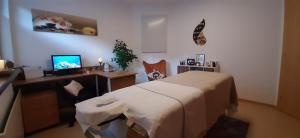 Televízia a/alebo spoločenská miestnosť v ubytovaní Appartement Catrin mit Sauna und E-Ladestation