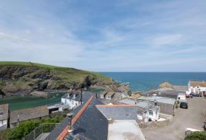a small town with a view of the ocean at Upper Deck, Port Isaac Bay Holidays in Port Isaac