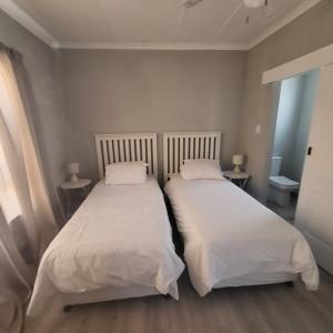 Postel nebo postele na pokoji v ubytování Villa Laks