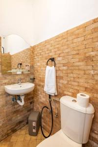 a bathroom with a toilet and a sink at Dar BAB HAHA Petite Maison à la Marocaine in Tangier