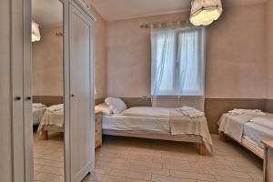 Letto o letti in una camera di BnB Borgo le Vigne - L'Uva rara Only Adults