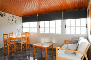 a living room with a couch and a table at Nue Apartment in Santa Cruz de Tenerife