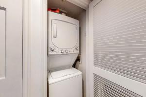 a washer and dryer in a small bathroom with a window at Wildflower Unit 8 in Park City