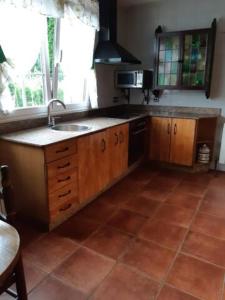 a kitchen with a sink and a counter top at Finca La Sierra in Pillarno +16 photos