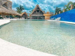 a large pool of water in a resort at Hotel Bello Caribe Express in Cozumel