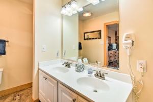 a bathroom with a white sink and a mirror at Fleetwood Cabin with Hot Tub Near Blue Ridge Pkwy! in Fleetwood +29 photos