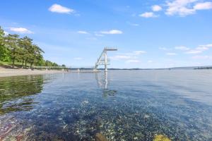 a bridge over a body of water at Pretty appartment close to Oslo in Asker