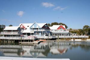 a group of houses on the water near a dock at South Beach Lane 47 in Hilton Head Island