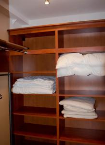 a bunk bed with white pillows on the bottom shelf at Blue Line Apartements in Arnoldstein