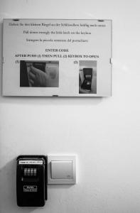 a picture of an electronic device on a wall at Blue Line Apartements in Arnoldstein