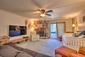 a living room with a couch and a bed at Angel Fire Mtn Escape Walk to Chile Express Lift! in Angel Fire