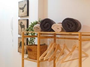 a shelf with towels and a basket on it at Brand New Studio 1 in Komotini