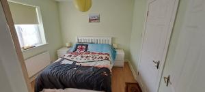 Voodi või voodid majutusasutuse Gort Lodge V23x673 toas